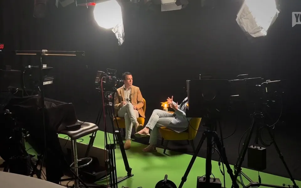 Recording in the StoryYo studio: two guests on set, with cameras and lights